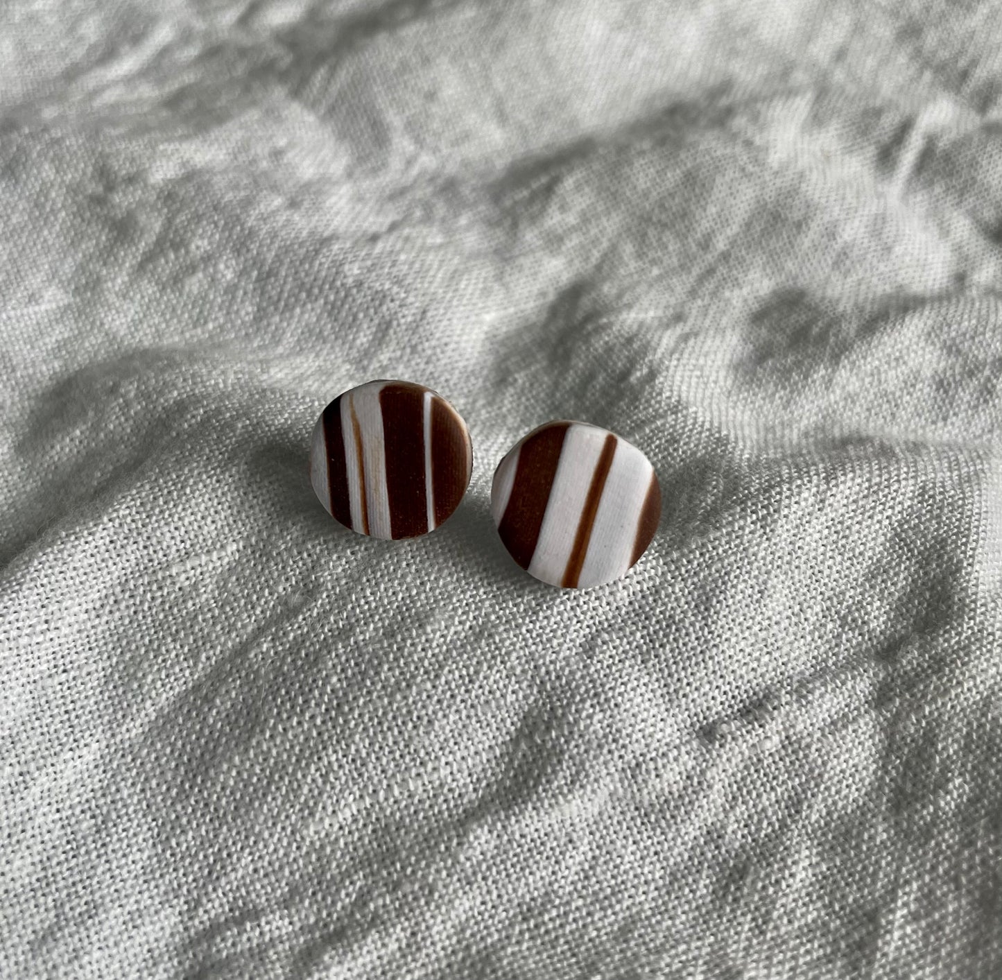 Brown swirl studs