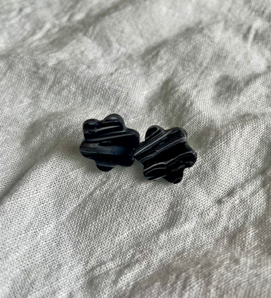 Black swirl flower studs