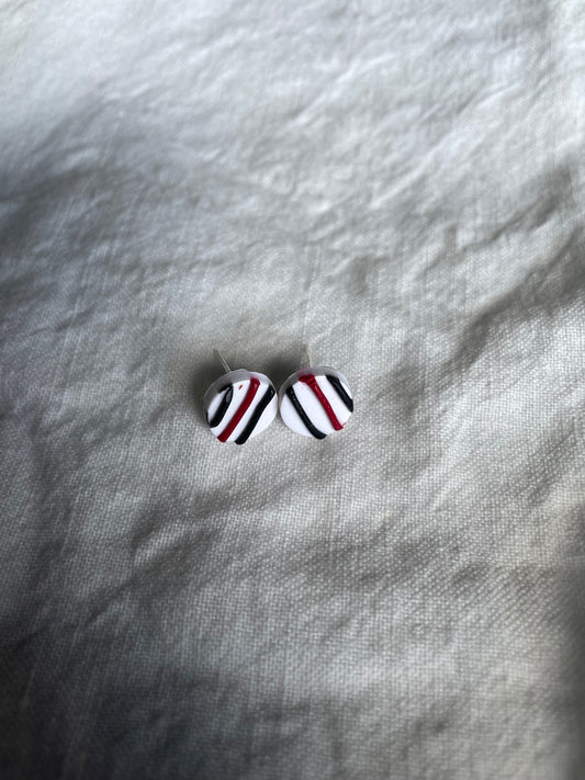 Red and black striped studs