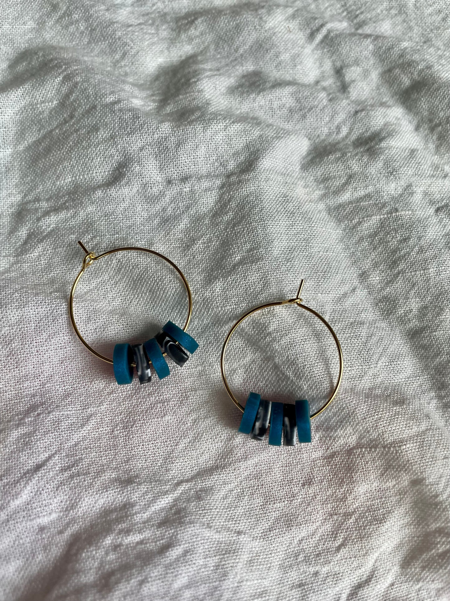 Teal and black swirl hoops